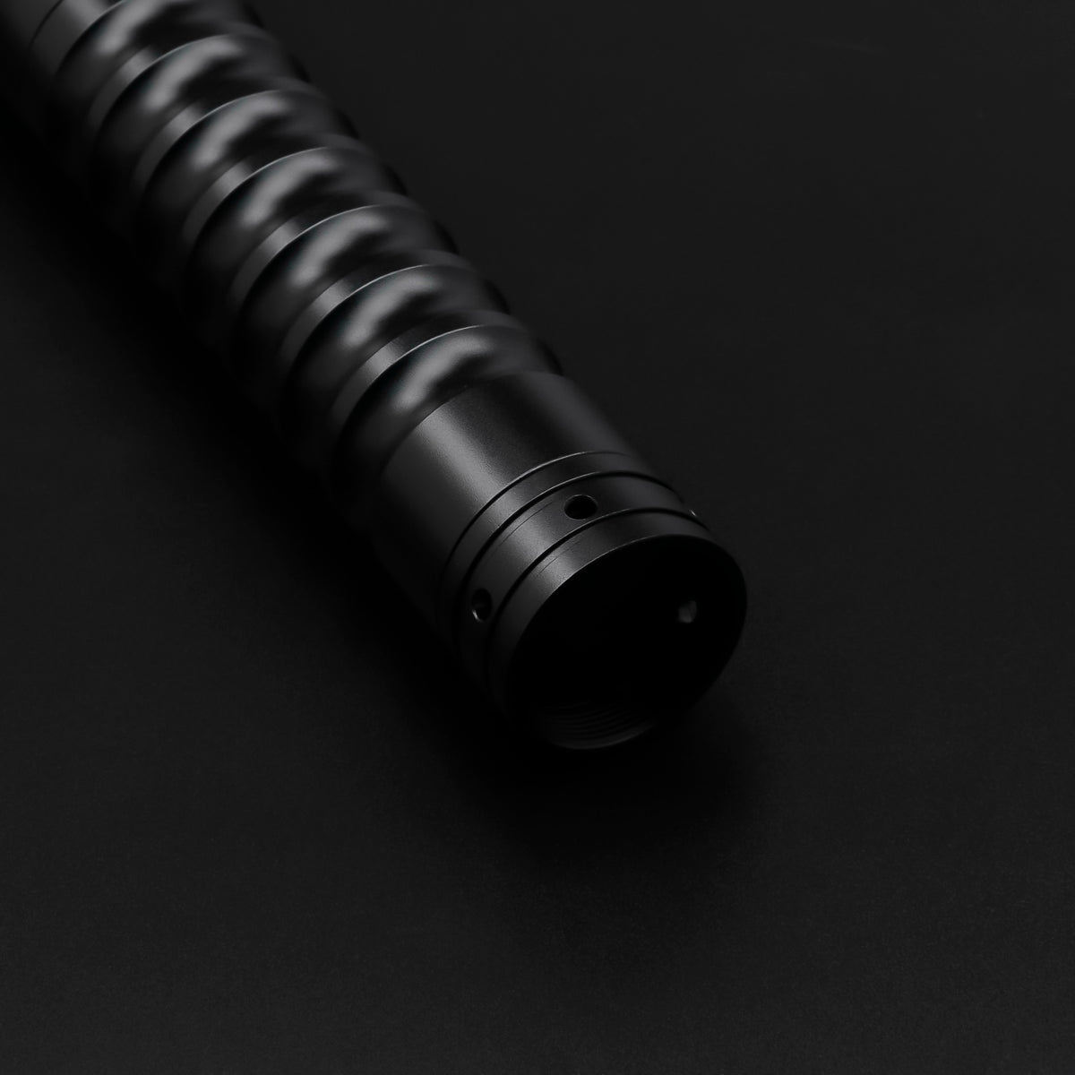 Black Starter Saber — pommel detail